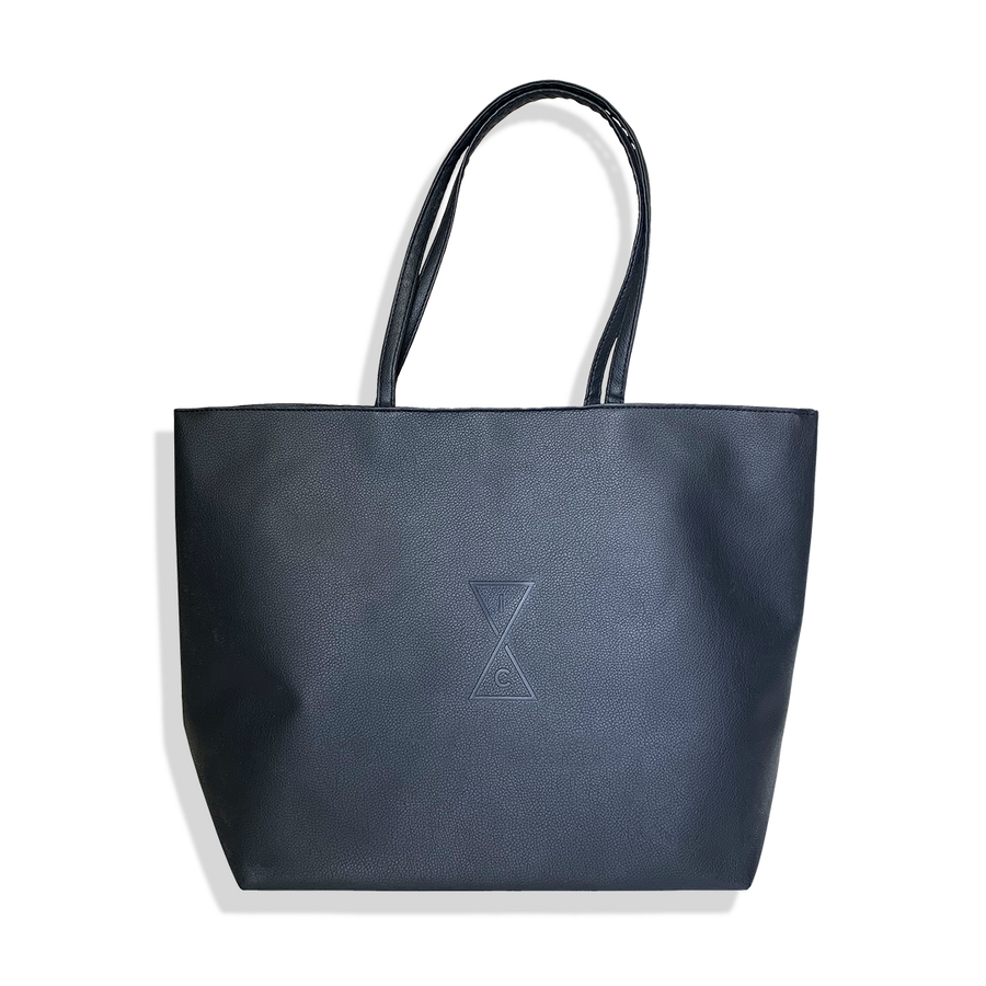 a black vegan leather looking tote bag